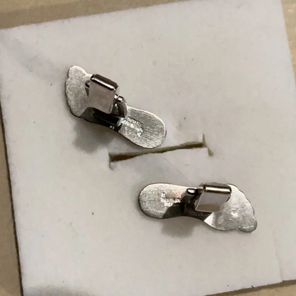 Rare set of Silver feet with onyx cuff links